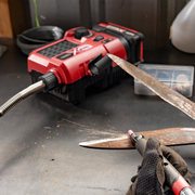 Red and black power tool with accessories 