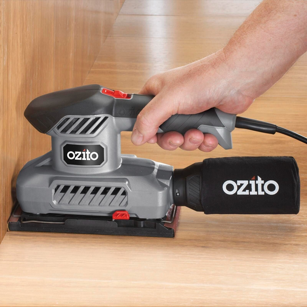 Ozito power sander with sandpaper sheets 