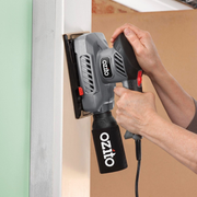 Ozito power sander with sandpaper sheets 