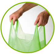 Roll of green and white dog waste bags with 'maze' branding 