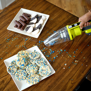 Handheld vacuum cleaner with yellow handle 